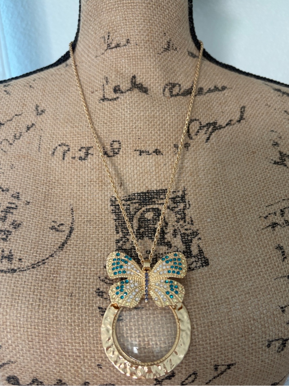 Gold Butterfly Magnifying Glass Necklace with Blue and Teal Accents